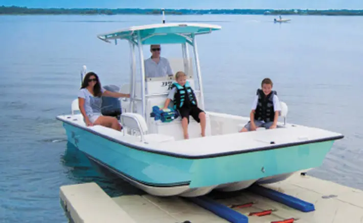 Family on boat docked using Wave Armor boat port in Cape Coral