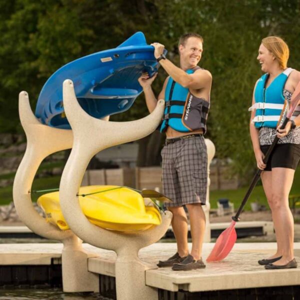 Couple storing kayaks on Wave Dock Kayak/Canoe Rack system