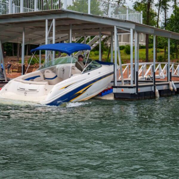Boat docking onto Wave Armor Extreme X24 Boat Port under covered dock