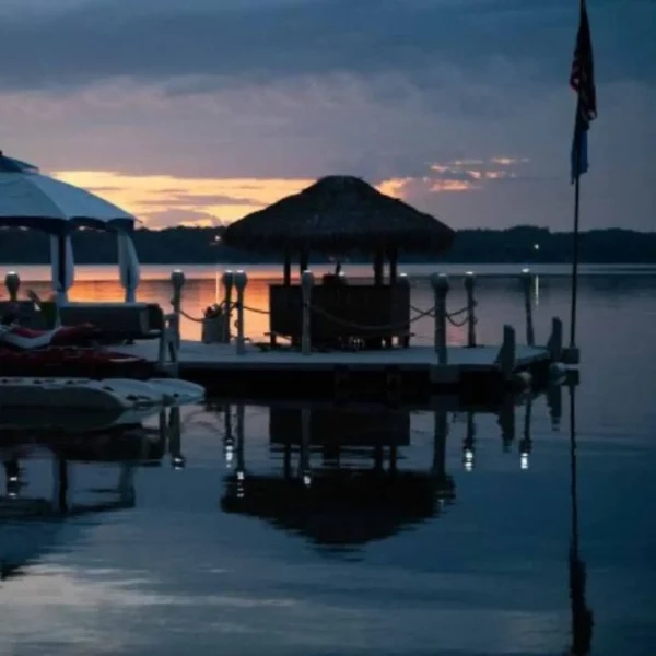 Wave Dock with solar lights illuminating dock edges at sunset