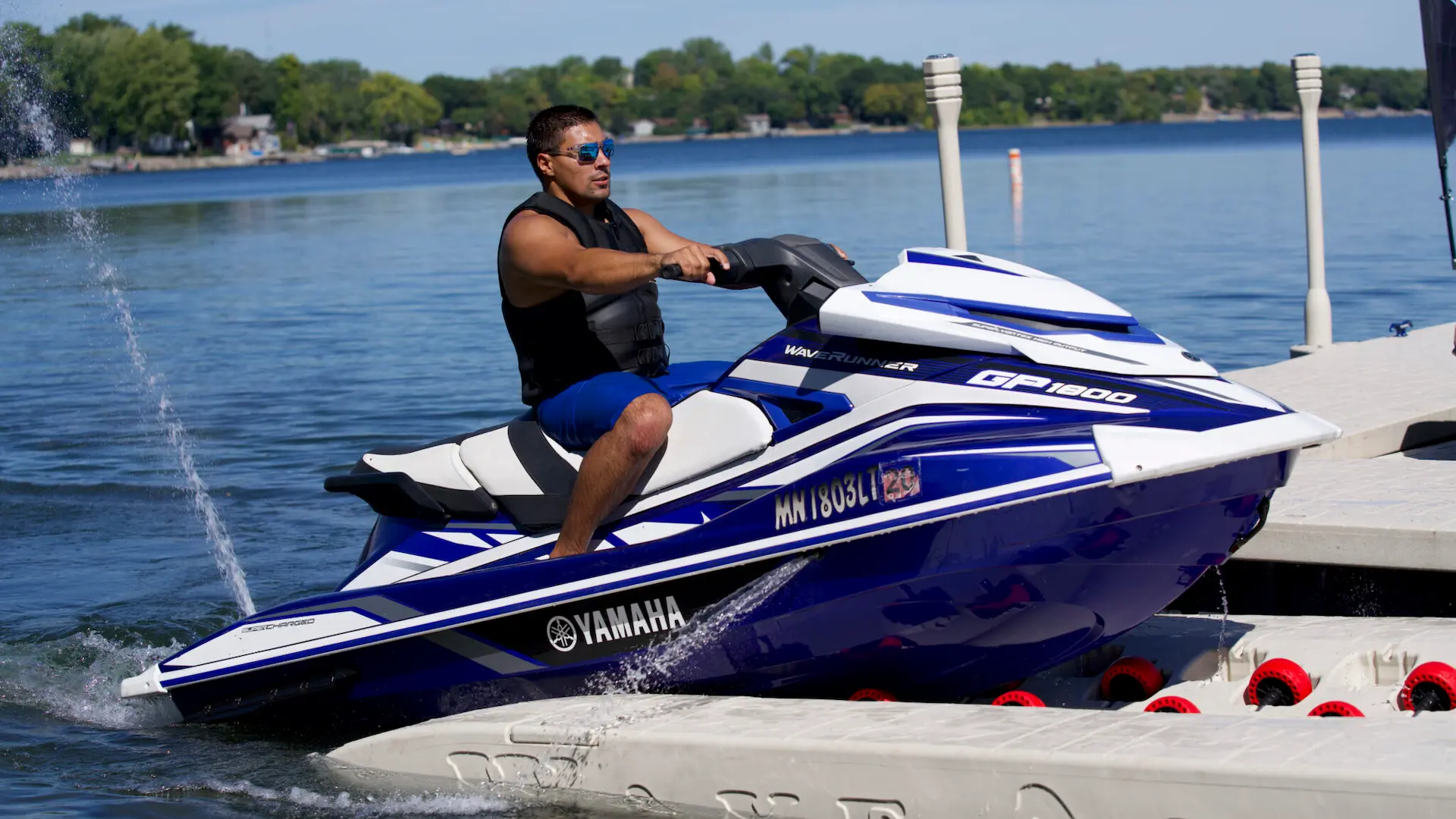 Man docking a Yamaha jet ski on a Wave Armor Pro Port 6 floating dock.