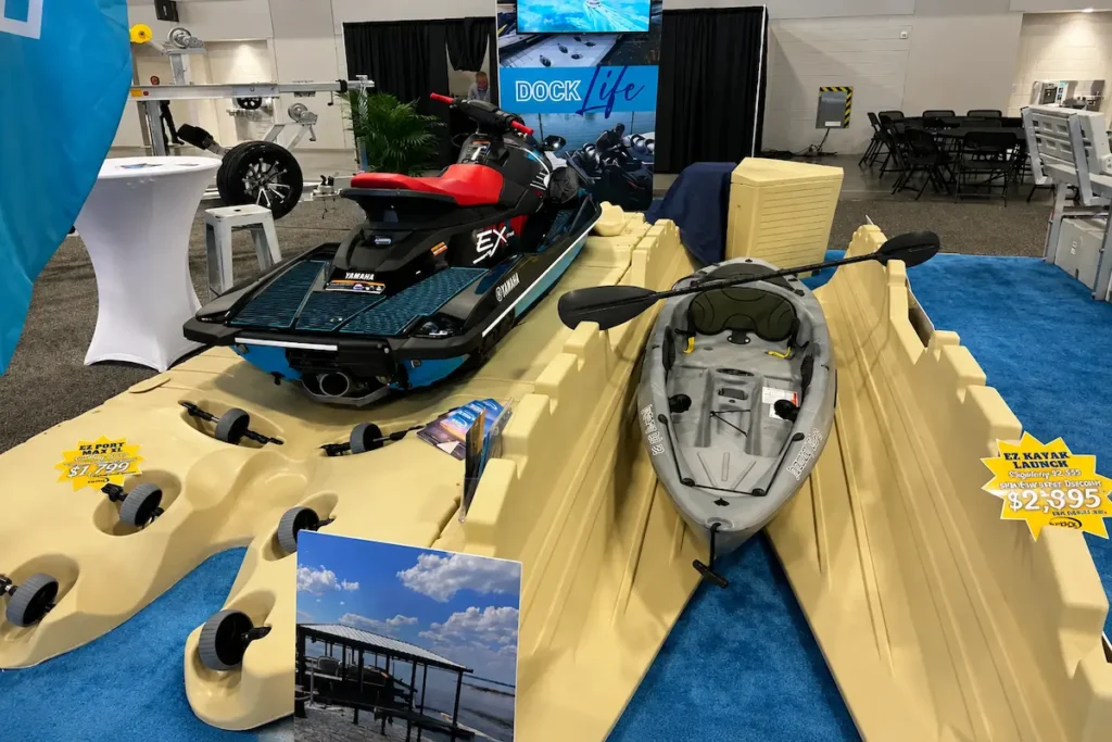 EZ Dock floating dock platform displayed at a marine expo for dock warranty comparison, featuring modular docking systems for jet skis, kayaks, and waterfront equipment durability evaluation.