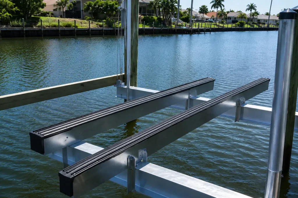 Boat lift Naples aluminum boat lift system installed over a residential waterfront canal in Southwest Florida