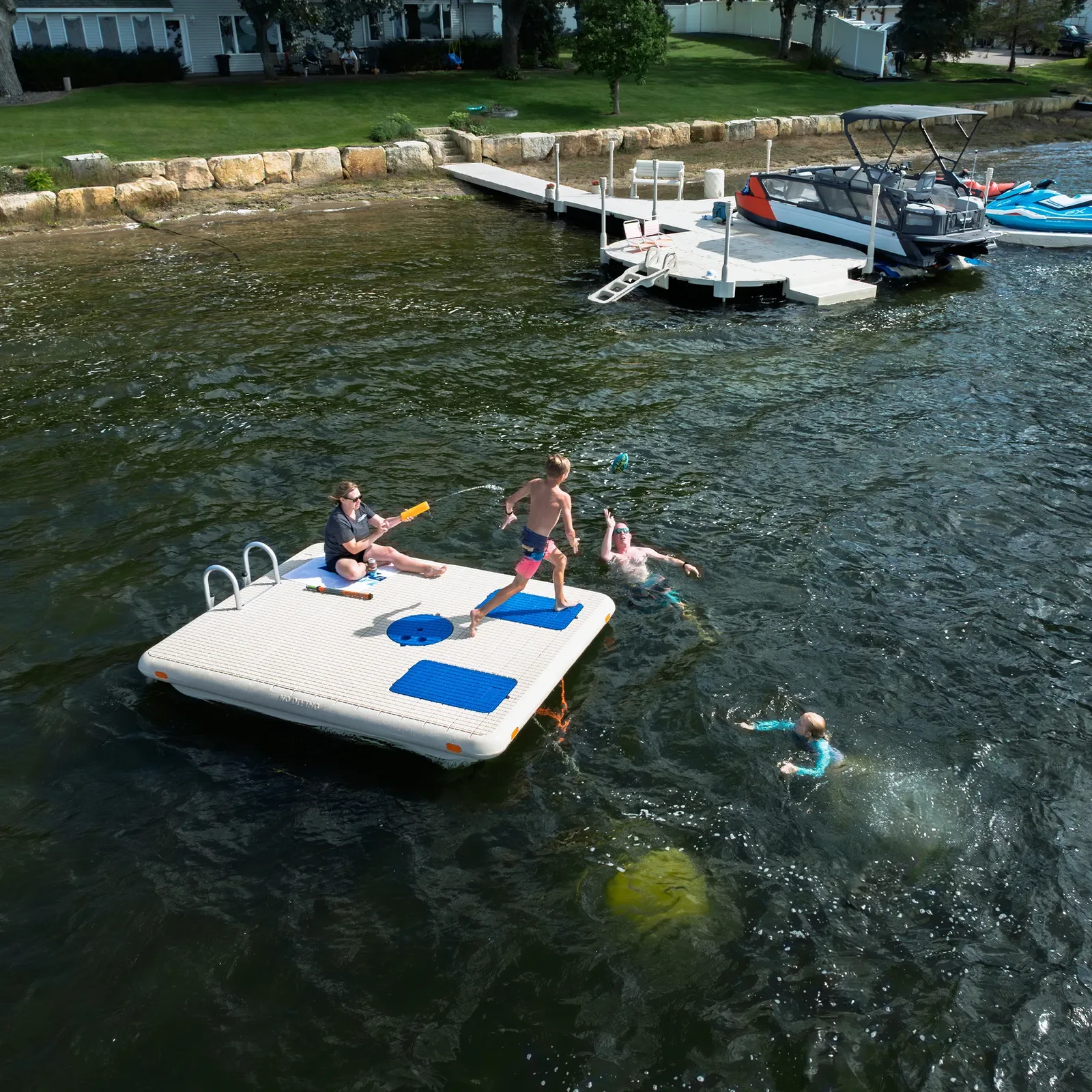 Friends relaxing on a Wave Armor swim raft