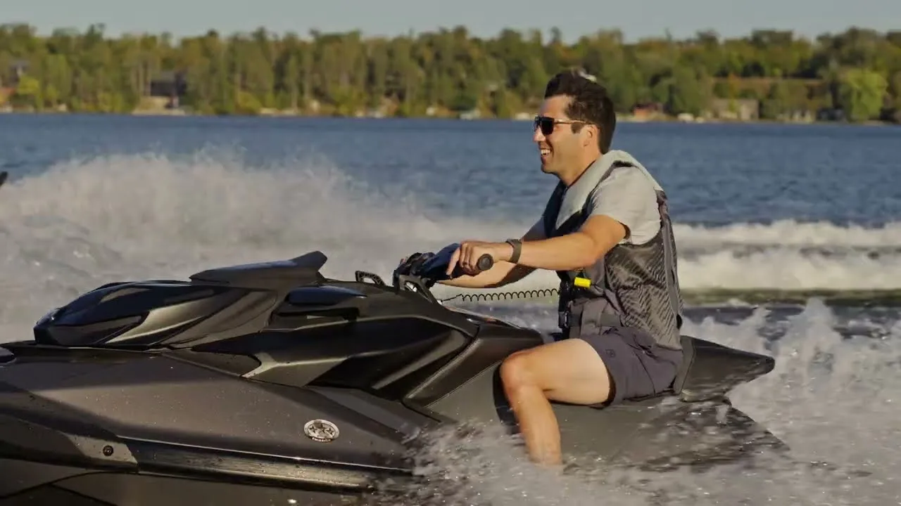 Personal watercraft rider approaching a Wave Armor floating PWC port on open water