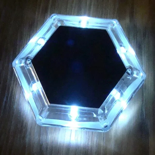 Wave Armor solar dock light glowing at night